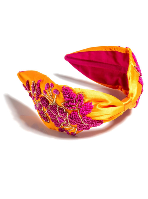 Add an elevated touch to your summer hairstyles with Shiraleah's Embellished Wide Headband. With its bright colors and intricate embroidered bead designs, this chic and trendy headband will be your new favorite summer accessory. Pair with other items from Shiraleah to complete your look!
