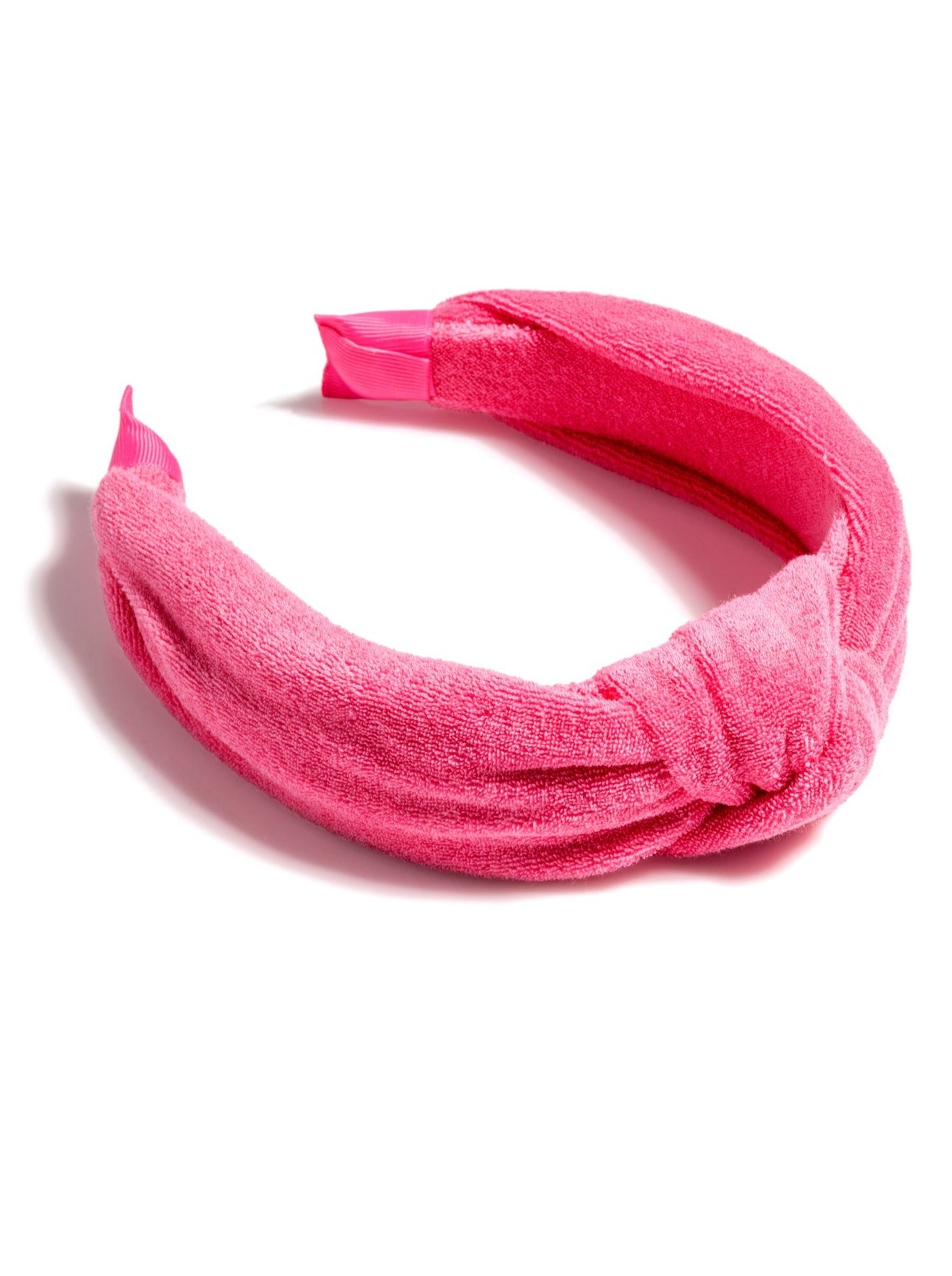 Add a trendy touch to your summer hairstyles with Shiraleah's Terry Knotted Headband. Made from soft and absorbent cotton terry, this versatile hair piece can be worn out on the town or by the poolside. Coming in eight vibrant shades, these colorful headbands match items from Shiraleah's Sol collection. Pair with other items from Shiraleah to complete your look!
