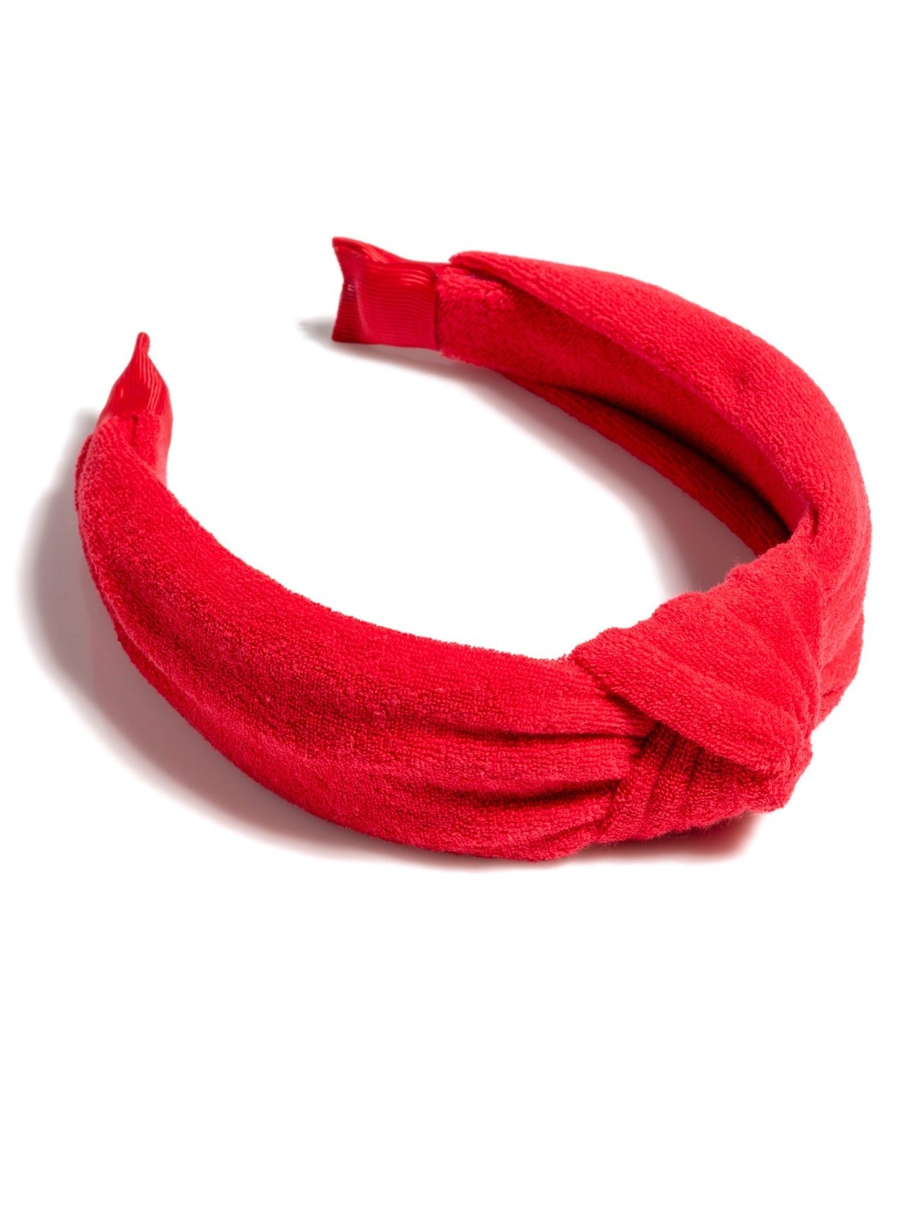 Add a trendy touch to your summer hairstyles with Shiraleah's Terry Knotted Headband. Made from soft and absorbent cotton terry, this versatile hair piece can be worn out on the town or by the poolside. Coming in eight vibrant shades, these colorful headbands match items from Shiraleah's Sol collection. Pair with other items from Shiraleah to complete your look!
