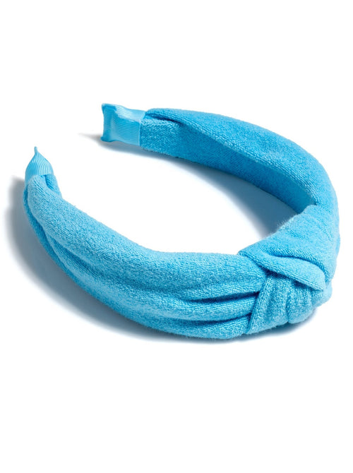 Add a trendy touch to your summer hairstyles with Shiraleah's Terry Knotted Headband. Made from soft and absorbent cotton terry, this versatile hair piece can be worn out on the town or by the poolside. Coming in eight vibrant shades, these colorful headbands match items from Shiraleah's Sol collection. Pair with other items from Shiraleah to complete your look!
