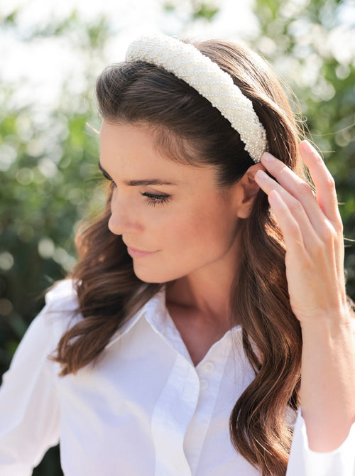 Add an elevated touch to your summer hairstyles with Shiraleah's Pearl Headband. With its subtle ivory color and intricately embroidered faux pearl details, this chic and trendy headband will be your new favorite summer accessory. Pair with other items from Shiraleah to complete your look!
