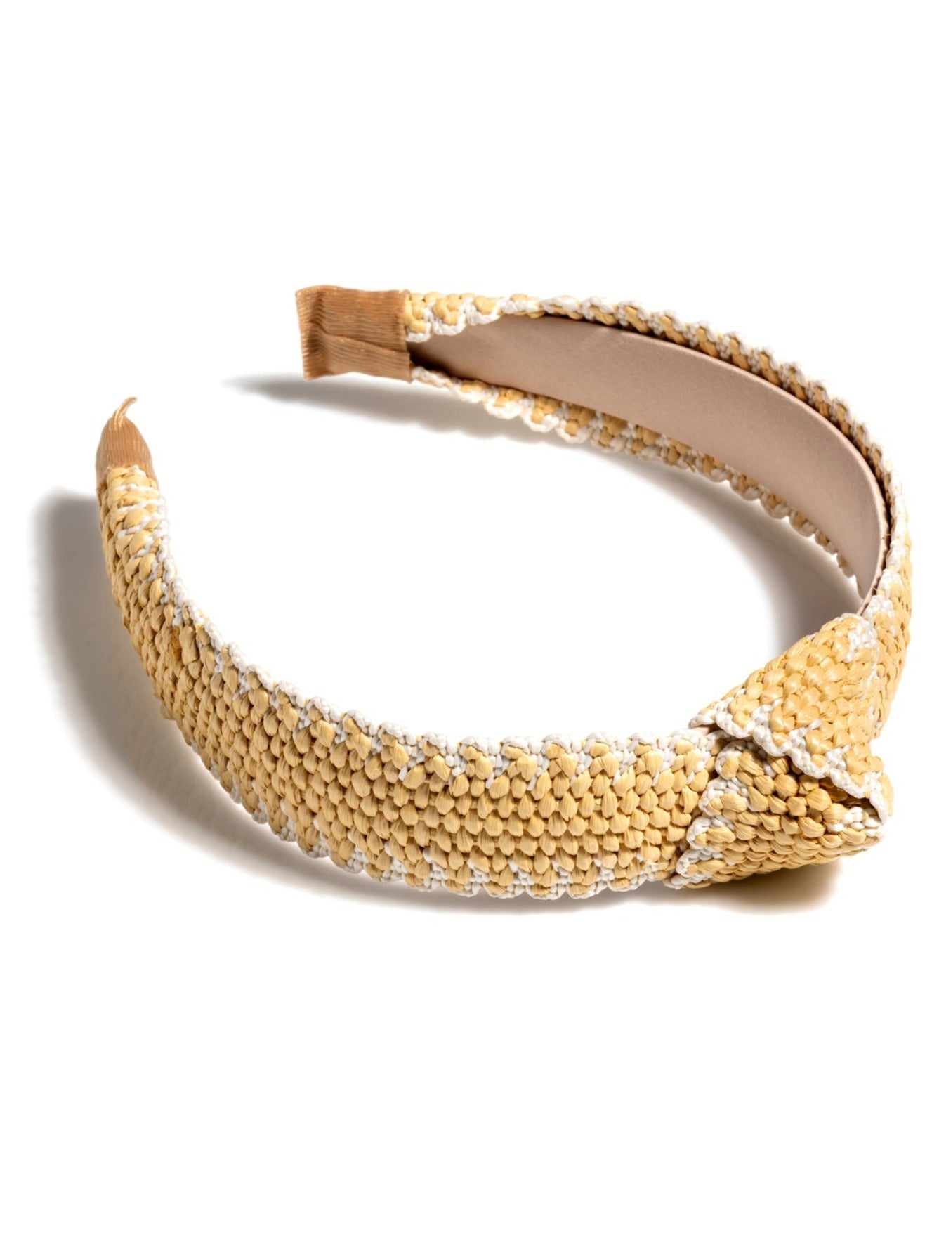 Add an elevated touch to your summer hairstyles with Shiraleah's Knotted Straw Headband. With its woven straw base and top knot detail, this chic and trendy headband will be your new favorite summer accessory. Pair with other items from Shiraleah to complete your look!
