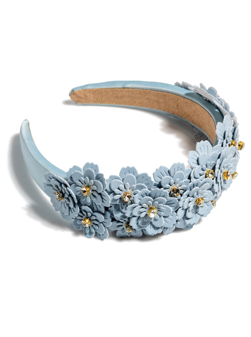 Add an elevated touch to your summer hairstyles with Shiraleah's Flower Embellished Headband. With its intricate floral and rhinestone embellishments, this chic and trendy headband will be your new favorite summer accessory. Pair with other items from Shiraleah to complete your look!
