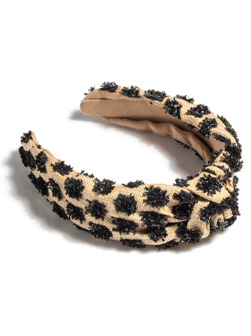 Add an elevated touch to your summer hairstyles with Shiraleah's Tufted Straw Knotted Headband. With its tufted fabric and top knot detail, this chic and trendy headband will be your new favorite summer accessory. Pair with other items from Shiraleah to complete your look!
