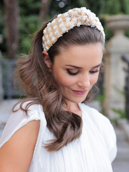 Add an elevated touch to your summer hairstyles with Shiraleah's Tufted Straw Knotted Headband. With its tufted fabric and top knot detail, this chic and trendy headband will be your new favorite summer accessory. Pair with other items from Shiraleah to complete your look!

