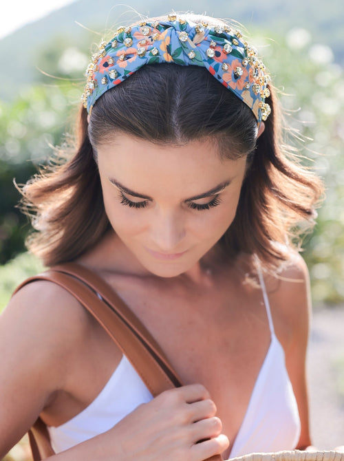 Add an elevated touch to your summer hairstyles with Shiraleah's Floral Embellished Knotted Headband. With its floral designs and rhinestone embellishments, this chic and intricate headband will be your new favorite summer accessory. Pair with other items from Shiraleah to complete your look!
