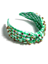 Add an elevated touch to your summer hairstyles with Shiraleah's Embellished Gingham Knotted Headband. With its classic gingham design and multicolored rhinestone details, this chic and feminine headband will be your new favorite summer accessory. Pair with other items from Shiraleah to complete your look!
