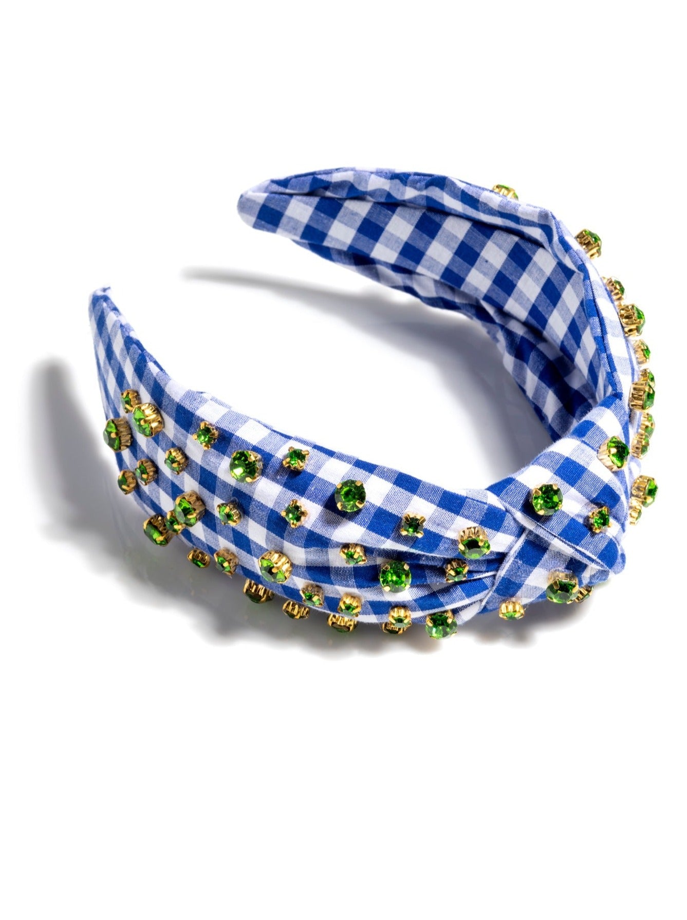 Add an elevated touch to your summer hairstyles with Shiraleah's Embellished Gingham Knotted Headband. With its classic gingham design and multicolored rhinestone details, this chic and feminine headband will be your new favorite summer accessory. Pair with other items from Shiraleah to complete your look!
