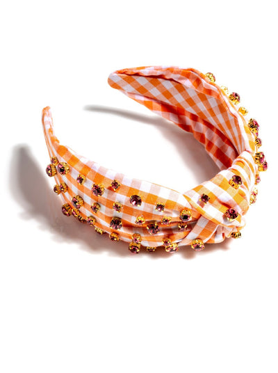 Add an elevated touch to your summer hairstyles with Shiraleah's Embellished Gingham Knotted Headband. With its classic gingham design and multicolored rhinestone details, this chic and feminine headband will be your new favorite summer accessory. Pair with other items from Shiraleah to complete your look!
