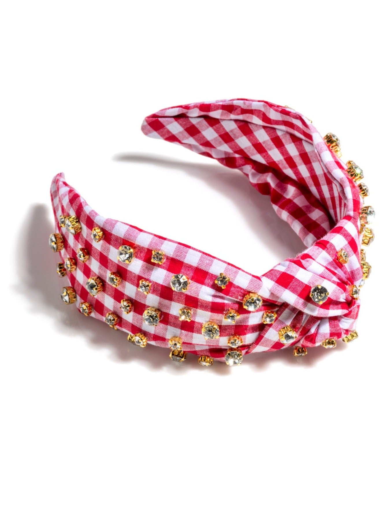 Add an elevated touch to your summer hairstyles with Shiraleah's Embellished Gingham Knotted Headband. With its classic gingham design and multicolored rhinestone details, this chic and feminine headband will be your new favorite summer accessory. Pair with other items from Shiraleah to complete your look!
