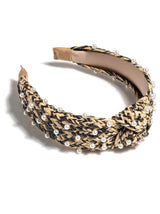 Add an elevated touch to your summer hairstyles with Shiraleah's Pearl Embellished Knotted Headband. With its classic braided straw design and faux pearl embellishments, this chic and feminine headband will be your new favorite summer accessory. Pair with other items from Shiraleah to complete your look!
