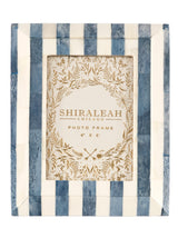 Put your favorite memories on display with Shiraleah’s Portofino Stripe Picture Frame. With a chic blue and white color scheme, this 4x6 frame adds an elegant flair to your table top décor. The easel back stand allows the frame to sit easily on any flat surface display with a strong glass barrier to protect your artwork. Mix and match with other Shiraleah frames to complete your home gallery's look!
