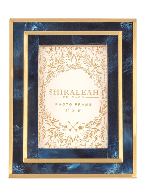 Put your favorite memories on display with Shiraleah’s Portofino Picture Frame. With a classic deep blue color and gold trim, this 4x6 frame adds an elegant flair to your table top décor. The easel back stand allows the frame to sit easily on any flat surface display with a strong glass barrier to protect your artwork. Mix and match with other Shiraleah frames to complete your home gallery's look!
