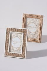 Put your favorite memories on display with Shiraleah’s Portofino Chevron Woven Picture Frame. With a natural braided design framed with bone, this 4x6 frame adds some fun boho flair to your table top décor. The easel back stand allows the frame to sit easily on any flat surface display with a strong glass barrier to protect your artwork. Mix and match with other Shiraleah frames to complete your home gallery's look!