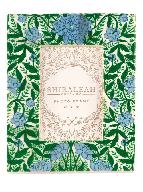 Put your favorite memories on display with Shiraleah’s Portofino Stripe Picture Frame. With a striking blue and green floral design, this 4x6 frame adds an elegant flair to your table top décor. The easel back stand allows the frame to sit easily on any flat surface display with a strong glass barrier to protect your artwork. Mix and match with other Shiraleah frames to complete your home gallery's look!
